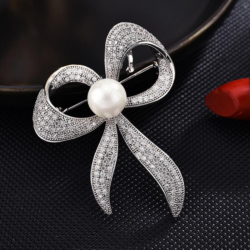 Pins, Brooches 2021 Woman Korean Fashion Bow Brooch Zircon Luxury Wild Silk Scarf Buckle Sweater Coat Clothing Accessories Wholesale
Pins, Brooches 2021 Woman Korean Fashion Bow Brooch Zircon Luxury Wild Silk Scarf Buckle Sweater Coat Clothing Accessories Wholesale