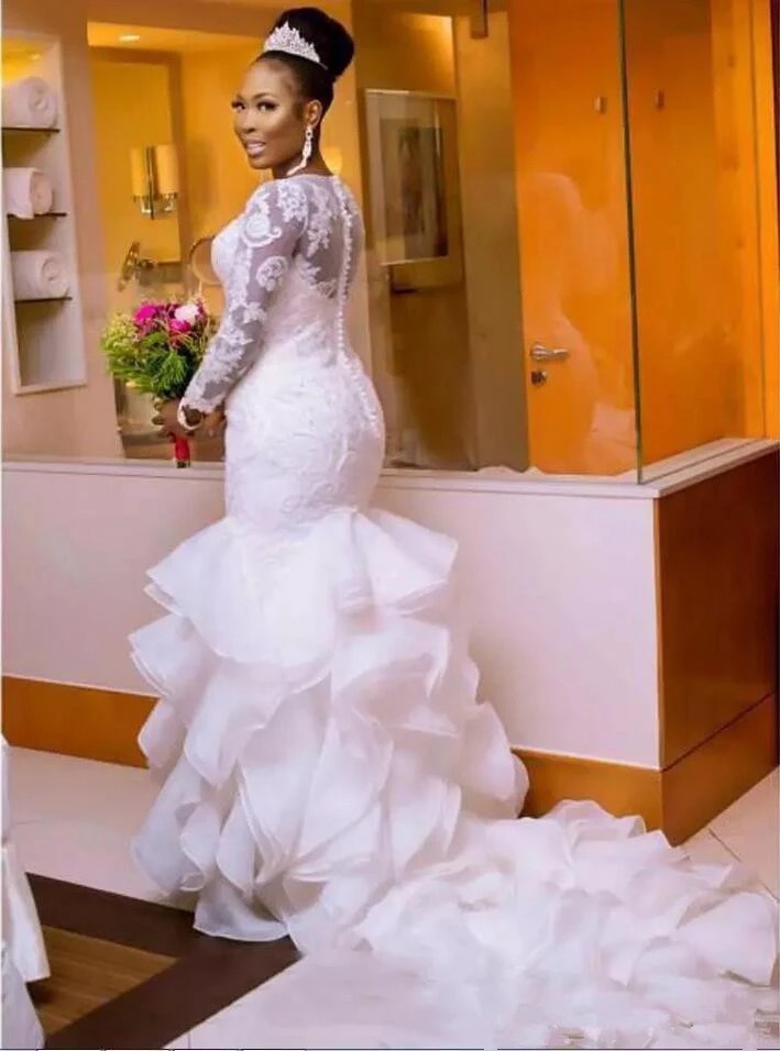 Gorgeous African Tiered Ruffles Mermaid Wedding Dresses For Bride 2022 Long Sleeves Lace Appliques Court Train Wedding Gowns Jewel Neck Back Buttons B