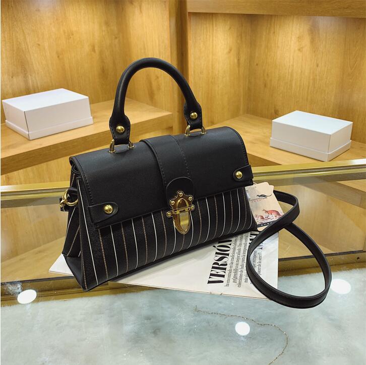 Wholesale factory ladies shoulder bags simple and elegant printed handbag street personalized rivet backpack European and American popular striped postman bag