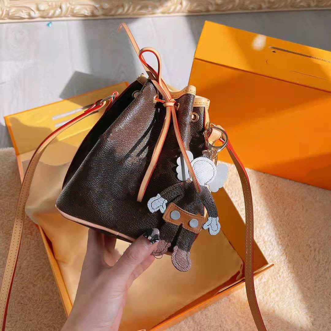 Mini Bucket Bag Fashion Designer Style with Letter Key Chain Pendant Women Straddle Shoulder Bags Crossbody Handbags, Black;red
Mini Bucket Bag Fashion Designer Style with Letter Key Chain Pendant Women Straddle Shoulder Bags Crossbody Handbags, Black;red