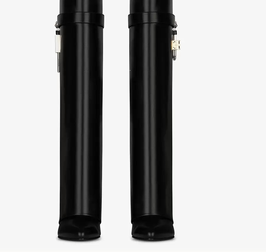 Top SHARK LOCK Knee boots leather silver and gold finish asymmetrical metal padlock clad wedge almond shaped toe heel height 9cm, Black
Top SHARK LOCK Knee boots leather silver and gold finish asymmetrical metal padlock clad wedge almond shaped toe heel height 9cm, Black