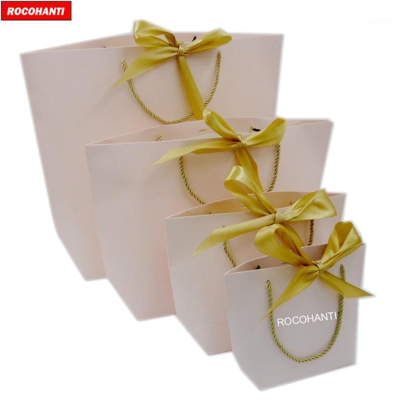 Gift Wrap 50X Elegant Customized Brand Logo Luxury Boutique Paper Shopping Bag Pink Bags With Bowknot 3 Strands Twisted Rope Handle
Gift Wrap 50X Elegant Customized Brand Logo Luxury Boutique Paper Shopping Bag Pink Bags With Bowknot 3 Strands Twisted Rope Handle