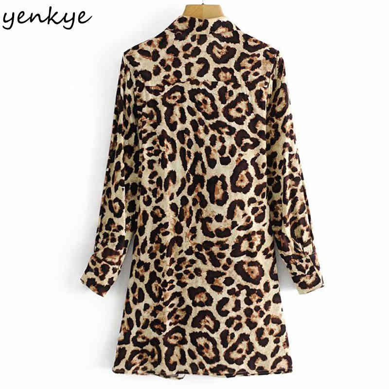YENKYE Fashion Women Front knot Sexy Leopard Dress Female Lapel Collar Long Sleeve Casual Dress Spring Plus Size Mini Robe 210515
