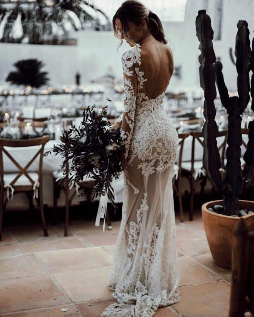 2021 Sexy Sheer Bohemian Mermaid Wedding Dresses Jewel Neck Illusion Long Sleeves Sheath Lace Appliqued Crystal Beads Backless Beach Boho Bridal Gowns
