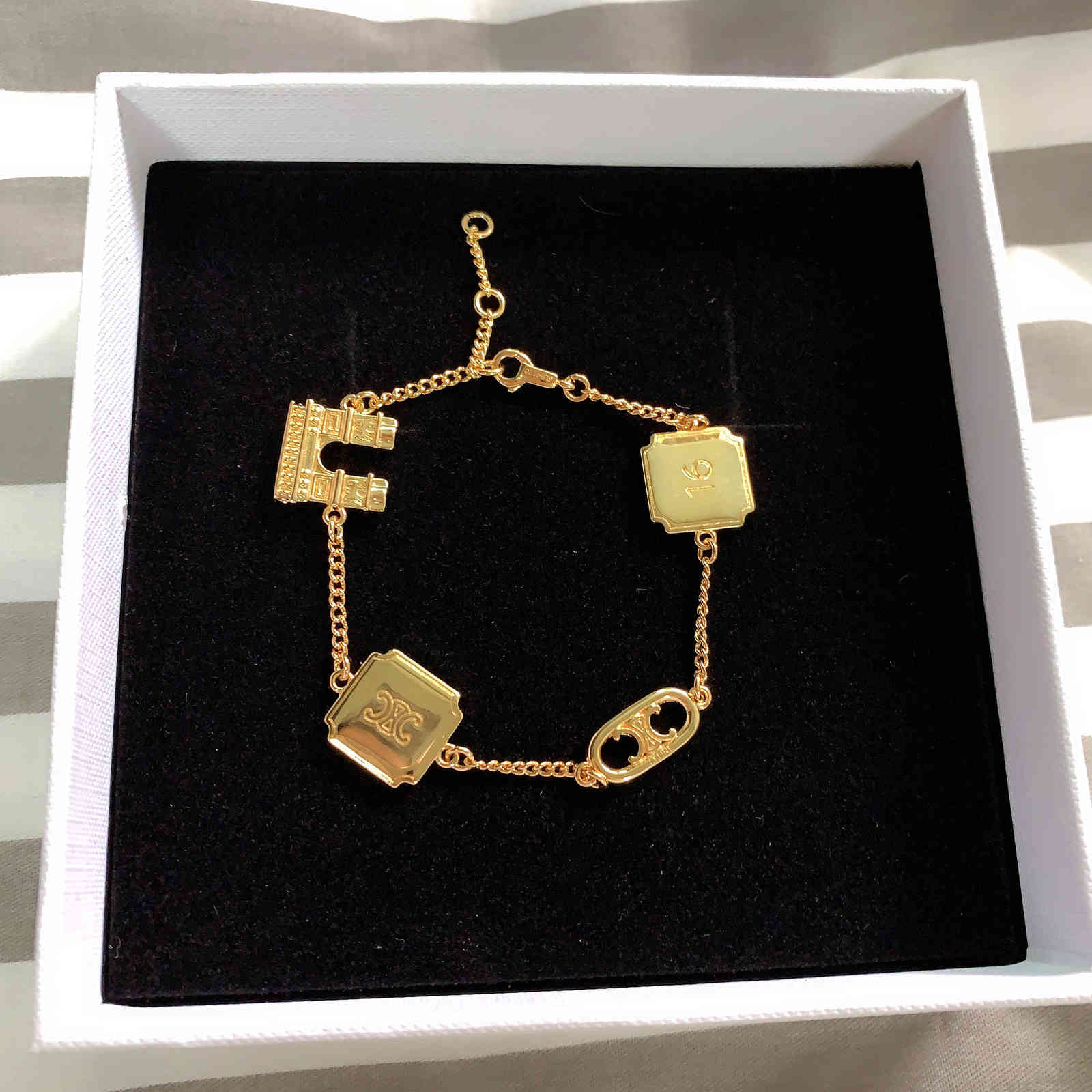 Arc Celi dimensional style three de Triomphe square alphabet 16 multi element pendant brass plated 18K Gold Bracelet fashionable, Black 
Arc Celi dimensional style three de Triomphe square alphabet 16 multi element pendant brass plated 18K Gold Bracelet fashionable, Black