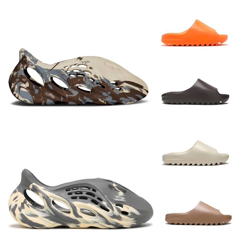 2021 Foam Runner Slipper Cream Clay Moon Gray Mineral Blue Ararat Men Womens Slide Bone Resin Desert Sand Earth Brown Flat Beach Sandals Enflame Orange With Box, Triple black
2021 Foam Runner Slipper Cream Clay Moon Gray Mineral Blue Ararat Men Womens Slide Bone Resin Desert Sand Earth Brown Flat Beach Sandals Enflame Orange With Box, Triple black
