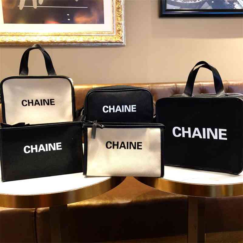 Fashion small fragrance cosmetic portable wind canvas letter hand fashion Quartet large capacity storage bag, Briefcase black 
Fashion small fragrance cosmetic portable wind canvas letter hand fashion Quartet large capacity storage bag, Briefcase black