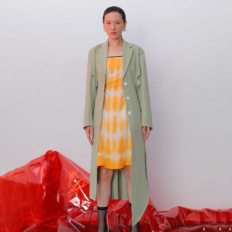 TWOTWINSTYLE Irregular Split Windbreaker For Female Lapel Collar Long Sleeve High Waist Hollow Out Drawstring Trench Coats Women 210820