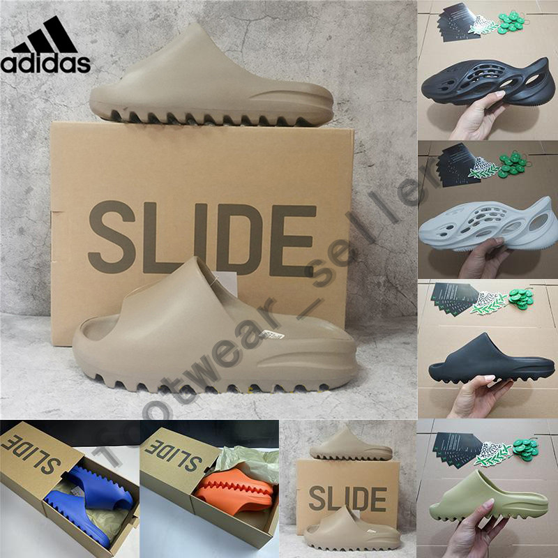 Yeezy Kanye West Slides Sandals Mens Slippers Resin Pure Triple Black Bone Foam Runner Moon Grey Ararat Desert Womens Designer Sandal With Box
Yeezy Kanye West Slides Sandals Mens Slippers Resin Pure Triple Black Bone Foam Runner Moon Grey Ararat Desert Womens Designer Sandal With Box