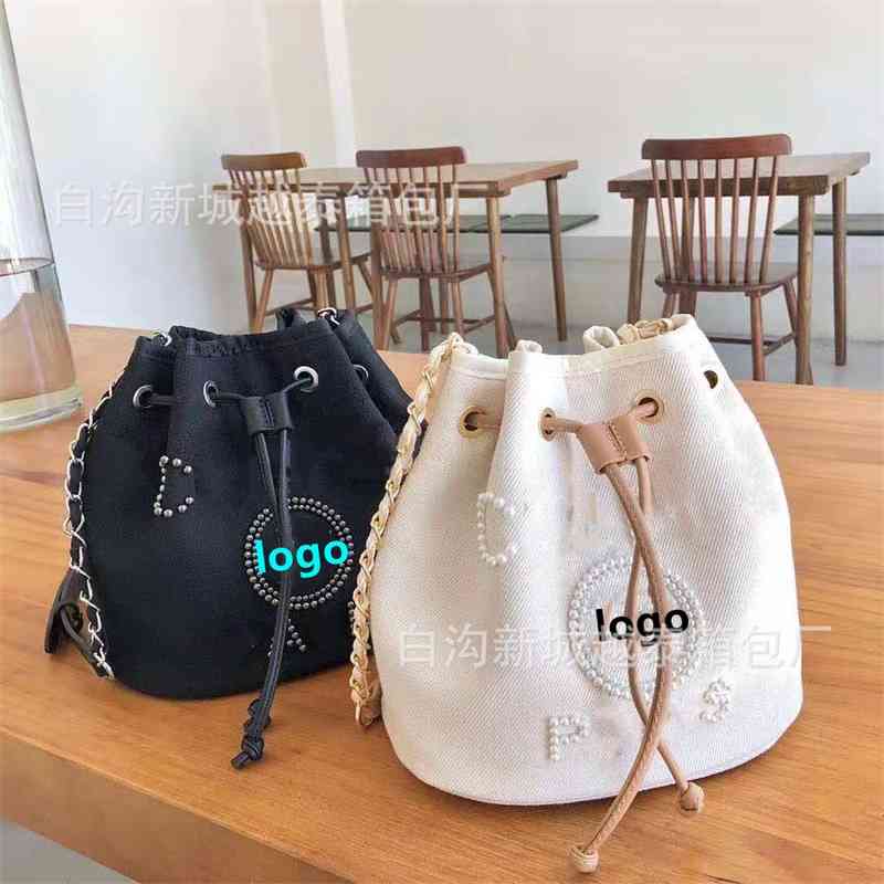 2021 new small fragrance net red pearl women's canvas drawstring bucket Single Shoulder Messenger bag
2021 new small fragrance net red pearl women's canvas drawstring bucket Single Shoulder Messenger bag
