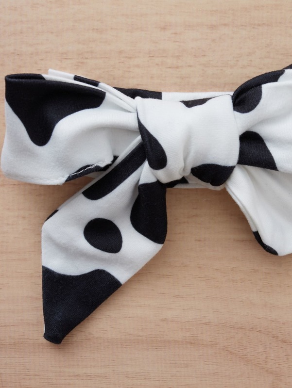 Baby Slogan Graphic Ruffle Trim Bodysuit & Cow Print Belted Pants & Headband SHE