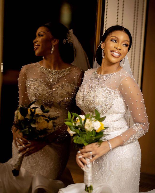 Luxury Pearls Mermaid Wedding Dresses 2022 Illusion Long Sleeve Sheer O-neck Ruffles Wave Cathedral Train African Lace-up Bridal Dress