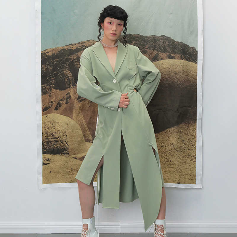 TWOTWINSTYLE Irregular Split Windbreaker For Female Lapel Collar Long Sleeve High Waist Hollow Out Drawstring Trench Coats Women 210820