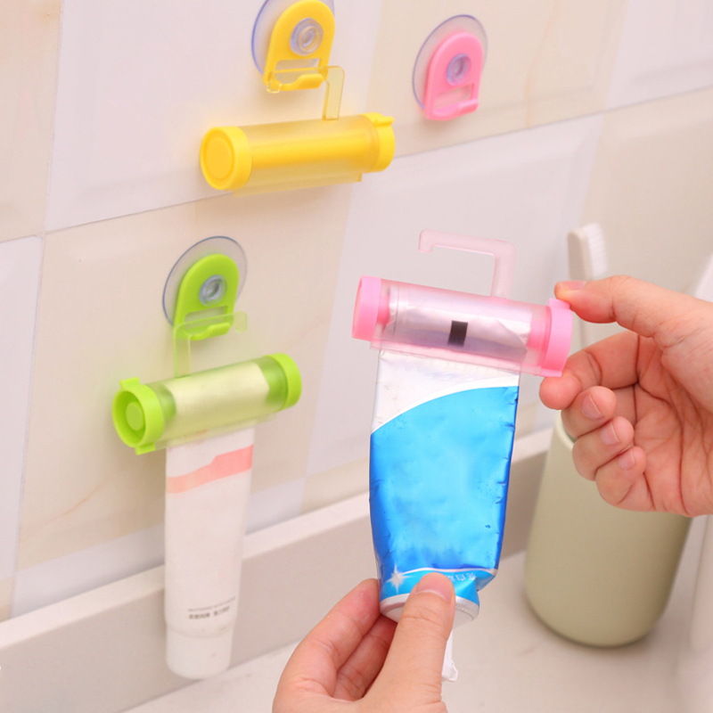 1Pcs With Sucker Hook Portable Multi Purpose Plastic Reuse Rolling Squeezer Toothpaste Dispenser Manual Bathroom Accessories