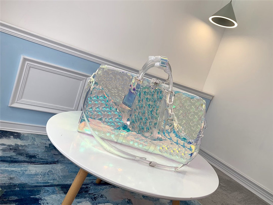 Fashion L Keepall 50 Bags 19SS Prism Bandouliere Iridescent Handbag Travel Bag M53271 Pastel Laser Flash Transparent Chain 50*29*23cm
Fashion L Keepall 50 Bags 19SS Prism Bandouliere Iridescent Handbag Travel Bag M53271 Pastel Laser Flash Transparent Chain 50*29*23cm