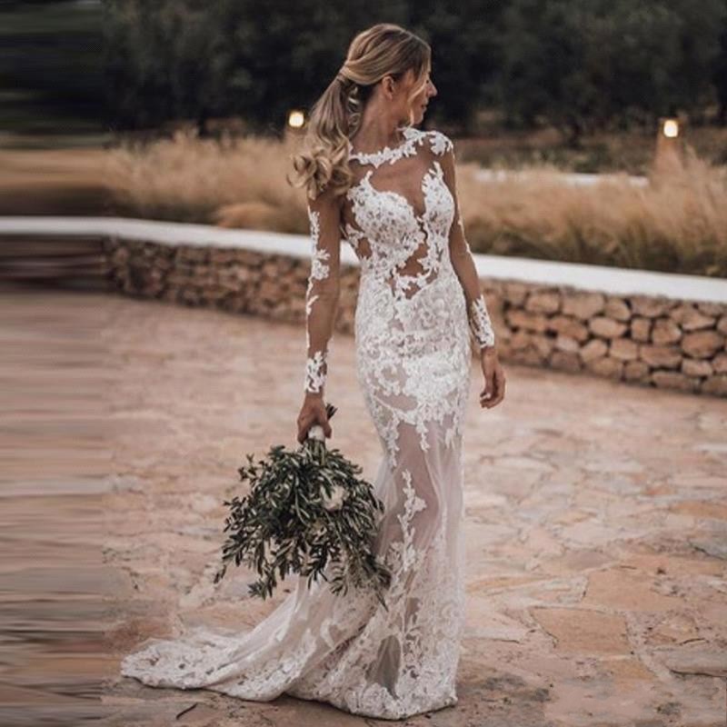 2021 Sexy Sheer Bohemian Mermaid Wedding Dresses Jewel Neck Illusion Long Sleeves Sheath Lace Appliqued Crystal Beads Backless Beach Boho Bridal Gowns