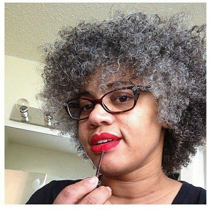 Beautiful woman with naturals grey kinky ponytail extension silver salt and pepper natural highlights dye free