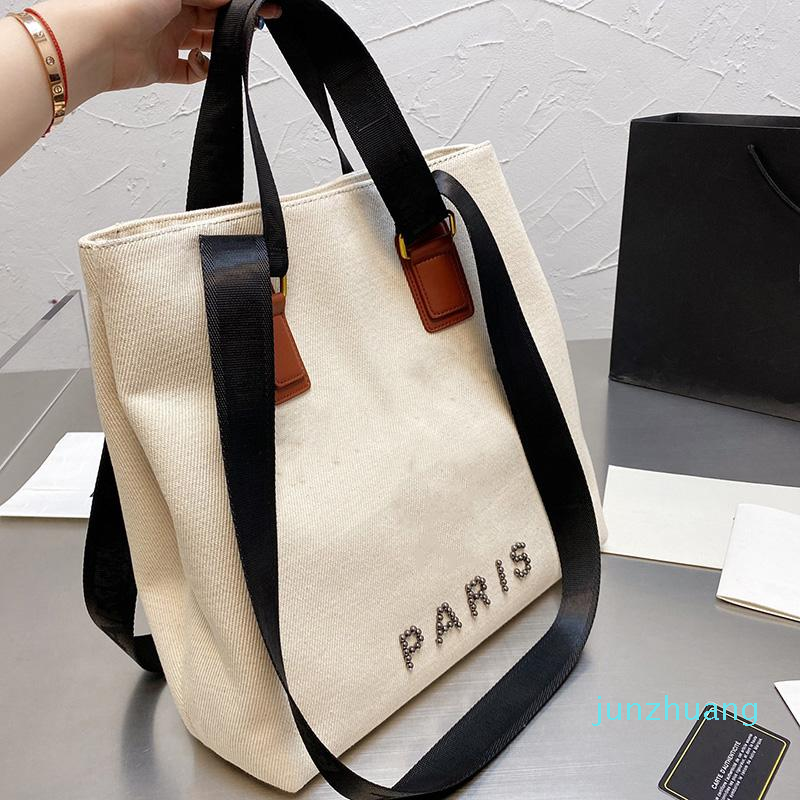 Designer- Women Beach bag Neutral solid color canvas pearl tote stylish travel women shopping portable large capacity one shoulder messenger
Designer- Women Beach bag Neutral solid color canvas pearl tote stylish travel women shopping portable large capacity one shoulder messenger
