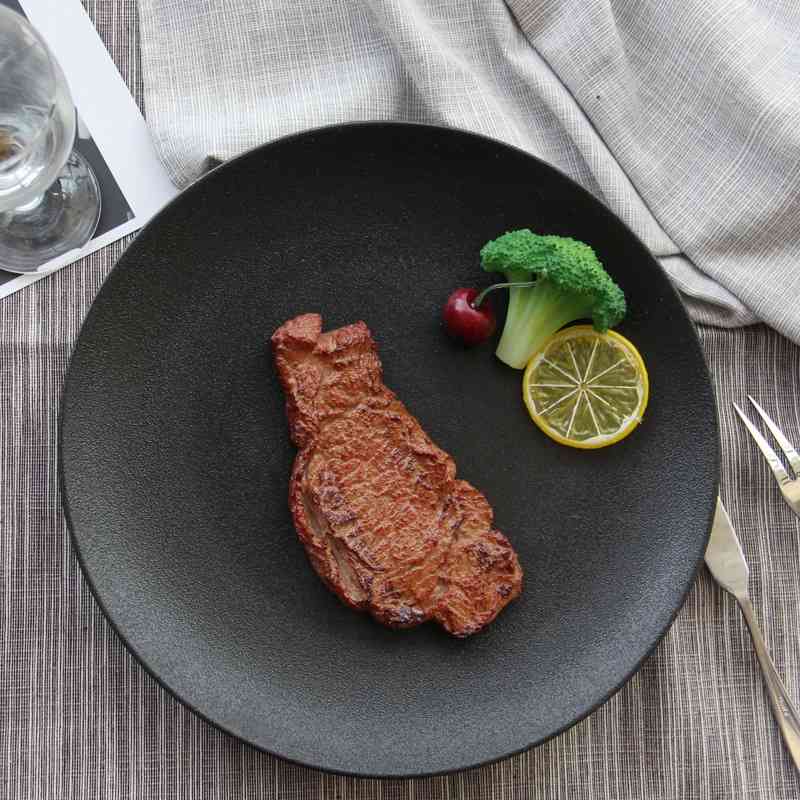 Frosted pure black ceramic matte round flat pasta steak Western food plate household
Frosted pure black ceramic matte round flat pasta steak Western food plate household