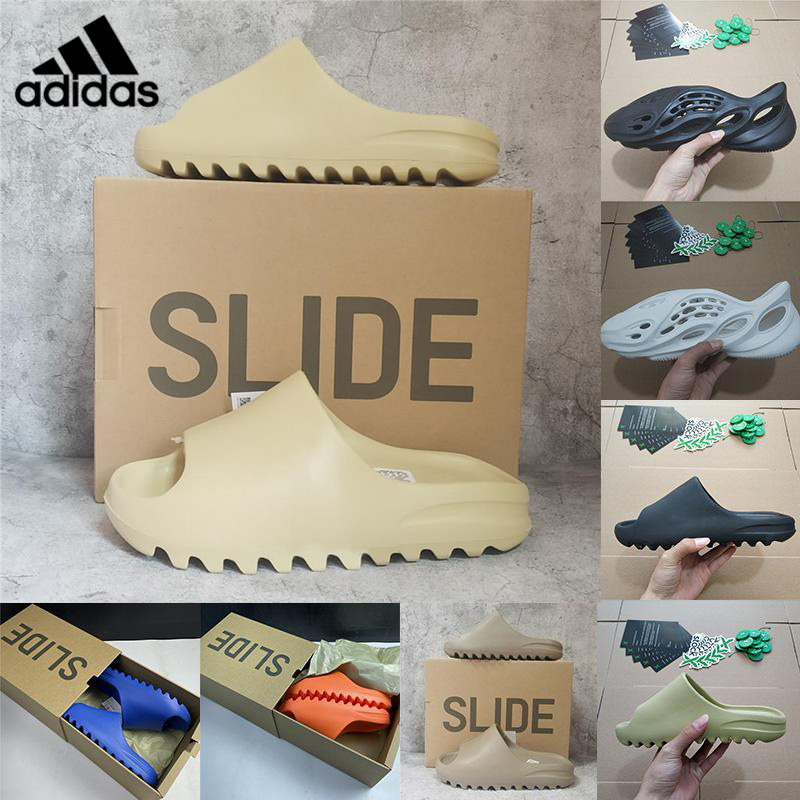 Kanye West With Box Designers Slides Flip Flops Slippers Pure Foam Runner Sand Triple Black Bone White Resin Slide Sandal Mens Slipper Man Womens pantoufle 
Kanye West With Box Designers Slides Flip Flops Slippers Pure Foam Runner Sand Triple Black Bone White Resin Slide Sandal Mens Slipper Man Womens pantoufle