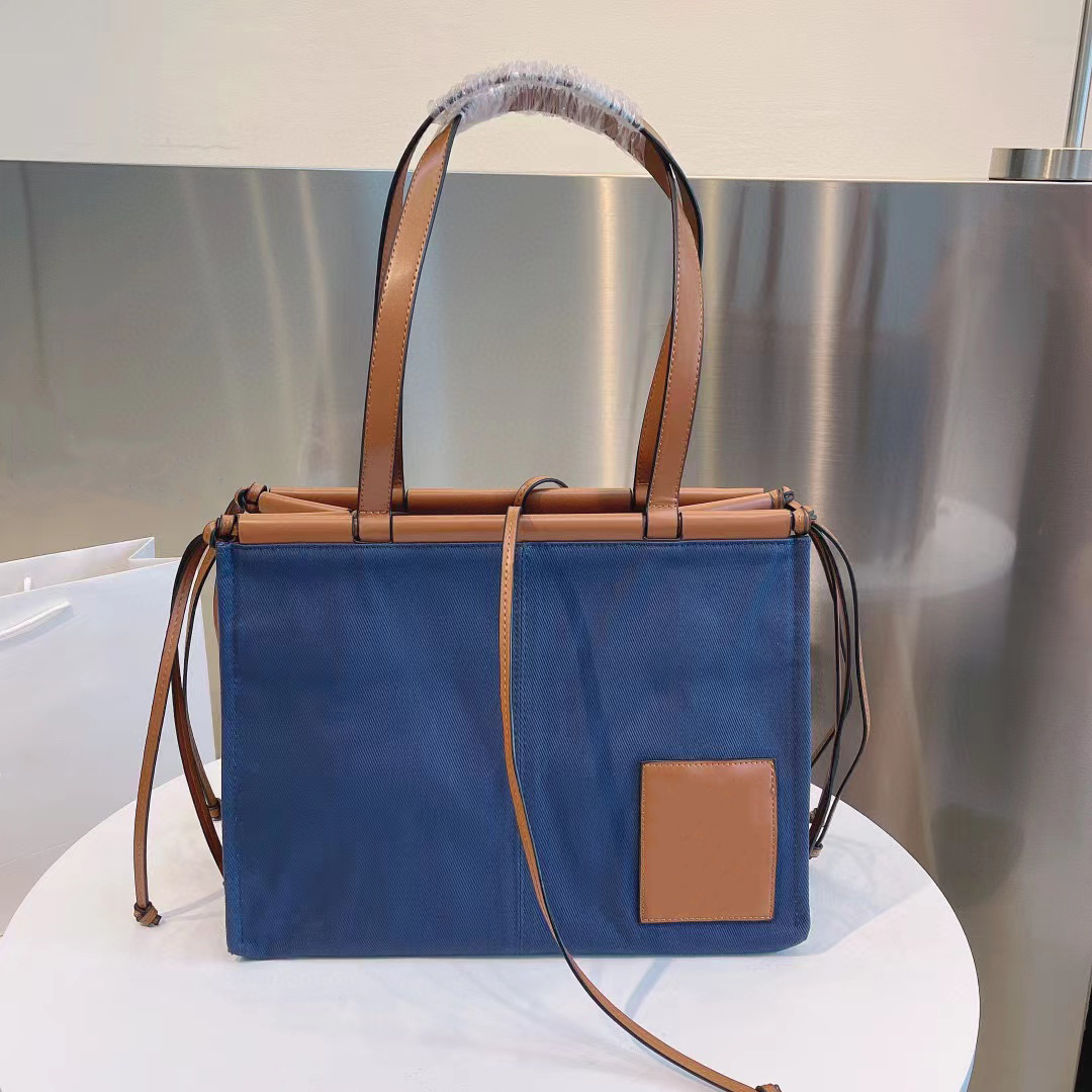 New Party Shopping Vacation Totes Wholesale Shoulder Bags Womens Handbags Cowhide Canvas Crossbody Knotted Belt Leather bag 6 Color 35*26cm, Not sold separately
New Party Shopping Vacation Totes Wholesale Shoulder Bags Womens Handbags Cowhide Canvas Crossbody Knotted Belt Leather bag 6 Color 35*26cm, Not sold separately