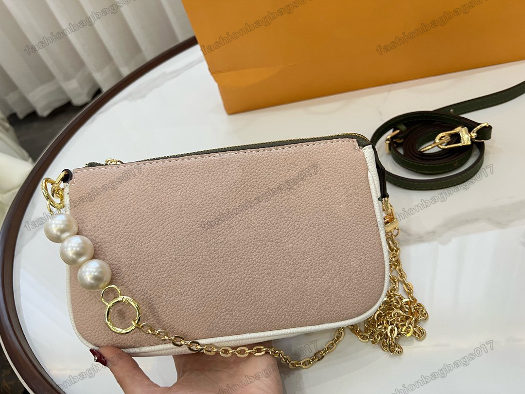 POCHETTE ACCESSOIRES Spring in the City Capsule Collection Bags Khaki / Beige / Cream Tricolor Monograms Empreinte Leather Luxurys Pearl Chain Bag
POCHETTE ACCESSOIRES Spring in the City Capsule Collection Bags Khaki / Beige / Cream Tricolor Monograms Empreinte Leather Luxurys Pearl Chain Bag