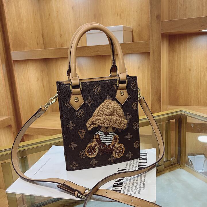 ladies leather bags this year&#039;s popular printed handbags sweet cute cartoon embroidered handbag street personality vertical contrast leather shoulder bag
