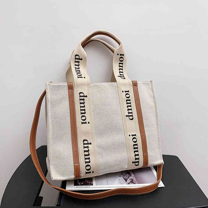 super fire same casual letter canvas stripe portable one shoulder diagonal straddle Tote women's bag new style
super fire same casual letter canvas stripe portable one shoulder diagonal straddle Tote women's bag new style