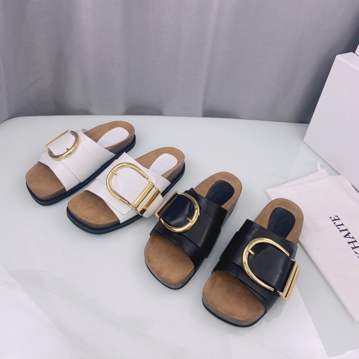 Khaite Thompson golden buckled leather slides slippers Luxe slip-on beach sandals shoes leather open toe casual flats for women Luxury Designers factory footwear, Black
Khaite Thompson golden buckled leather slides slippers Luxe slip-on beach sandals shoes leather open toe casual flats for women Luxury Designers factory footwear, Black