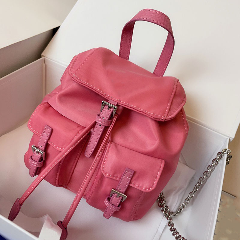 Re-Nylon mini Backpack Designer Womens Handbags Black Exterior Bag Pockets with Metal Straps Large Capacity SchoolBag size 17cm, Pink
Re-Nylon mini Backpack Designer Womens Handbags Black Exterior Bag Pockets with Metal Straps Large Capacity SchoolBag size 17cm, Pink