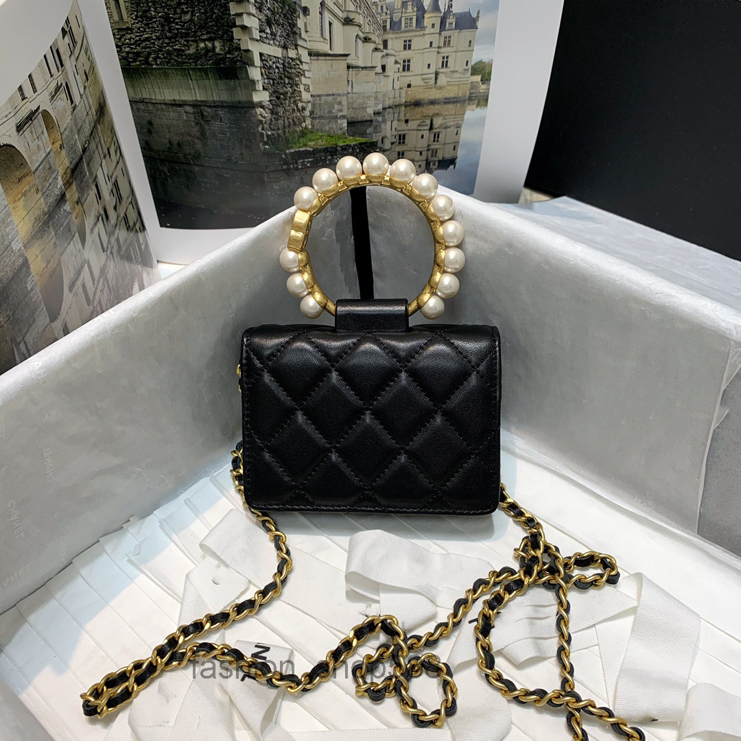 Designer bags Black Pearl Handle Clutch Black and gold color big portable one-shoulder crossb
Designer bags Black Pearl Handle Clutch Black and gold color big portable one-shoulder crossb