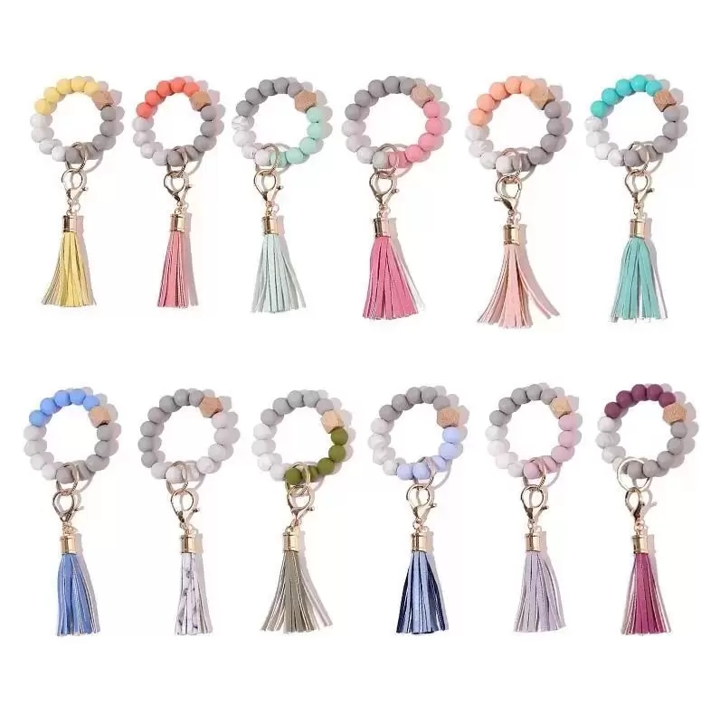 Silicone Beaded Bangle Key chain with Tassel for Women Party Favor Wrist let Key Ring Bracelet
Silicone Beaded Bangle Key chain with Tassel for Women Party Favor Wrist let Key Ring Bracelet