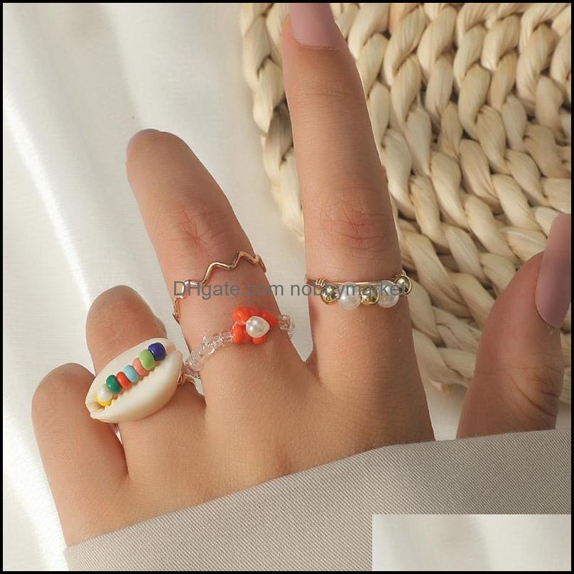 4 Pcs/Set Bohemian Female Gold Color Metal Transparent Crystal Beads Shell Handmade Beaded Flower Rings Set For Women Jewelry Drop Delivery
4 Pcs/Set Bohemian Female Gold Color Metal Transparent Crystal Beads Shell Handmade Beaded Flower Rings Set For Women Jewelry Drop Delivery