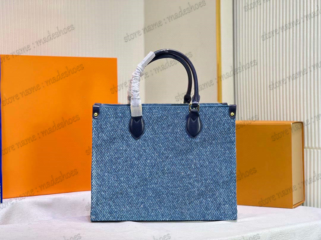 Denim Onthego On The Go MM Tote Navy Blue Black Jacquard Shoulder Bag Monograms Stone-washed effect Handle Bags Luxury Handbag Women Designer CrossBody 35cm
Denim Onthego On The Go MM Tote Navy Blue Black Jacquard Shoulder Bag Monograms Stone-washed effect Handle Bags Luxury Handbag Women Designer CrossBody 35cm