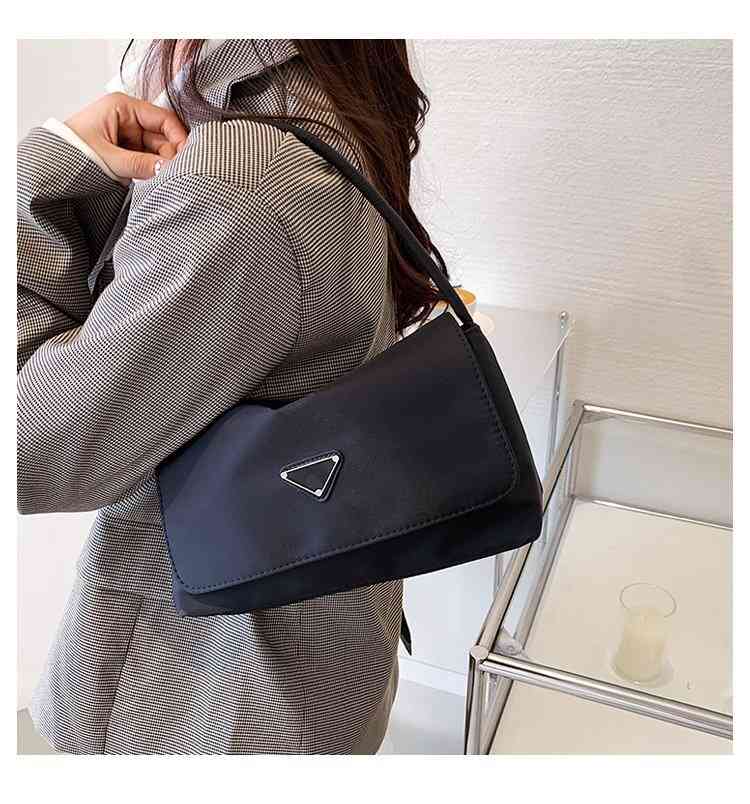 Handbags Triangle standard women's 2022 new Nylon Oxford small messenger sling one shoulder armpit bag Purse, Black
Handbags Triangle standard women's 2022 new Nylon Oxford small messenger sling one shoulder armpit bag Purse, Black