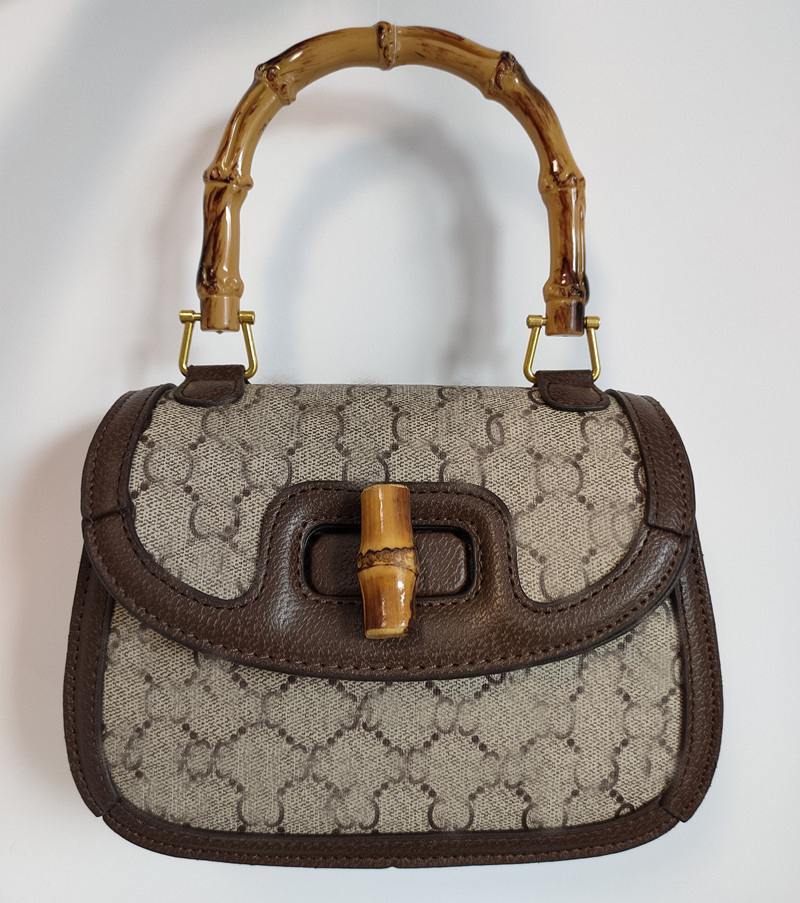 Bamboo totes bag Luxury Designer Brand Fashion Shoulder Womens bag classic style Handbags Metallic phone lady Elegant latter, Brown color with logo 21x16cm
Bamboo totes bag Luxury Designer Brand Fashion Shoulder Womens bag classic style Handbags Metallic phone lady Elegant latter, Brown color with logo 21x16cm