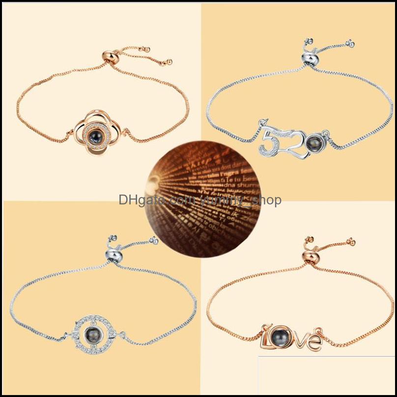 Charm Bracelets Jewelry Letter Sier Gold 100 Languages I Love You Bracelet Romantic Memory Wedding - 0010Wh Drop Delivery 2021 Huozy
Charm Bracelets Jewelry Letter Sier Gold 100 Languages I Love You Bracelet Romantic Memory Wedding - 0010Wh Drop Delivery 2021 Huozy