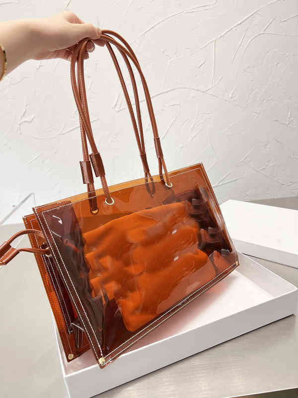 Transparent Pvc Tote Bag for Women Summer Beach Designer Lady Handbags Luxury Jelly Shoulder Crossbody Casual Purse 220624, Grey
Transparent Pvc Tote Bag for Women Summer Beach Designer Lady Handbags Luxury Jelly Shoulder Crossbody Casual Purse 220624, Grey