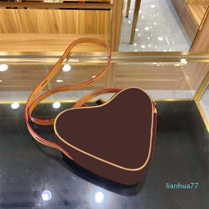 Designer- fashion letter pattern single shoulder crossbody bag heart-shaped designer bags PU leather classic models252o, Brown
Designer- fashion letter pattern single shoulder crossbody bag heart-shaped designer bags PU leather classic models252o, Brown