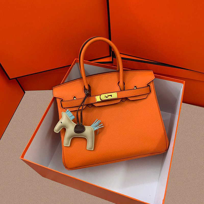 Platinum bag cowhide leather brand imitation of the women handbag 2021 large capacity classic luxury fashion handbags, Customize
Platinum bag cowhide leather brand imitation of the women handbag 2021 large capacity classic luxury fashion handbags, Customize
