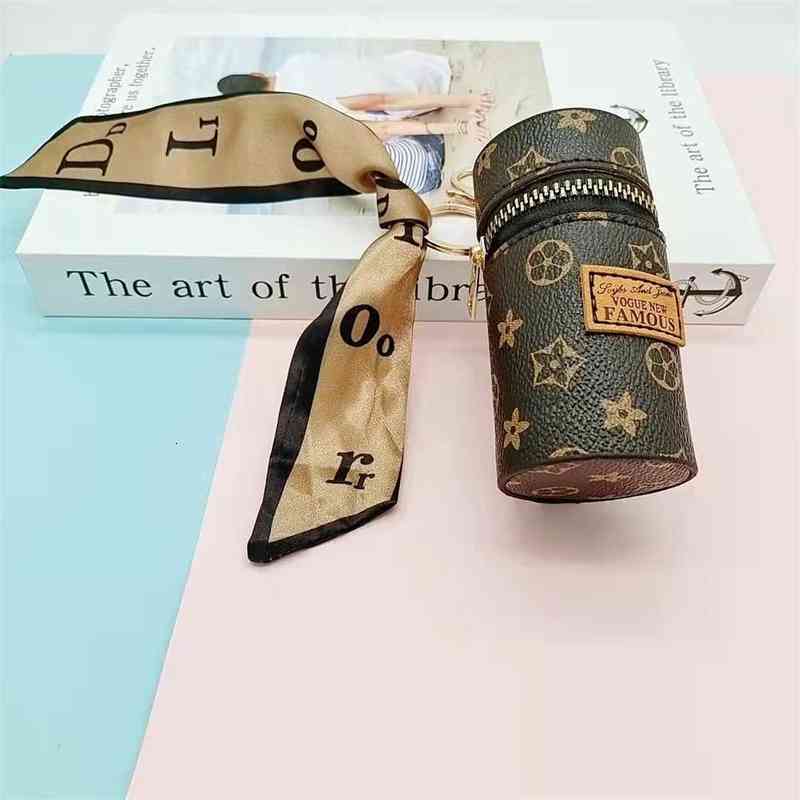 Mini PU leather lipstick organizer case key chain rings silky scarf decor designers classic lippie lipsticks holders makeup bag cylindrical, Brown
Mini PU leather lipstick organizer case key chain rings silky scarf decor designers classic lippie lipsticks holders makeup bag cylindrical, Brown