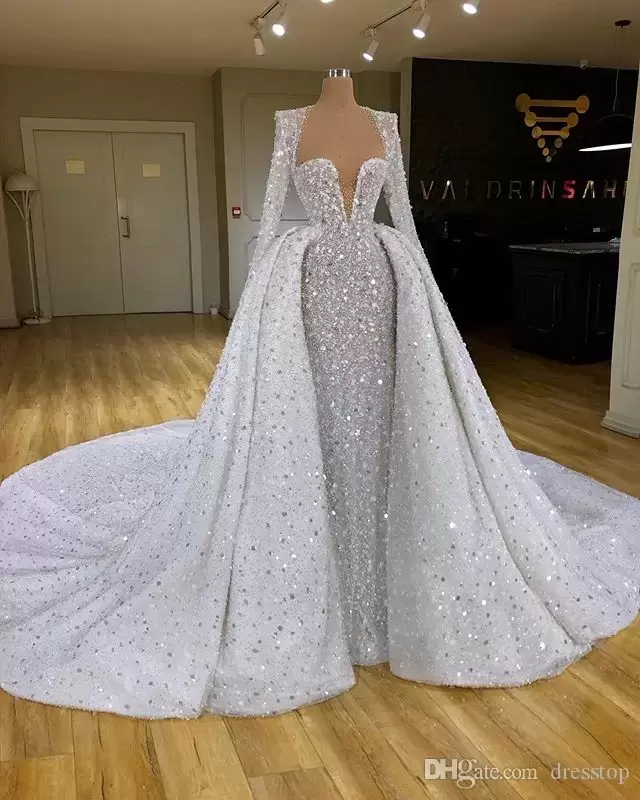 2022 Sparkly Sequins Mermaid Wedding Dresses Overskirt Bridal Gown Long Sleeves Sweep Train Beaded Crystals Custom Made Plus Size Bateau Necke Robe De