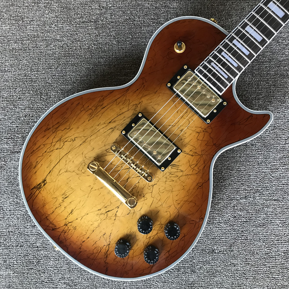 Custom LP electric guitar, gold hardware, rosewood fingerboard, Decaying wood top, solid mahogany body guitar
Custom LP electric guitar, gold hardware, rosewood fingerboard, Decaying wood top, solid mahogany body guitar