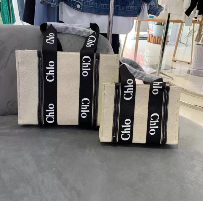 Top quality Women handbags WOODY Tote shopping bag handbag high NYLON hobo fashion linen Large Beach bags luxury designer travel Crossbody2368
Top quality Women handbags WOODY Tote shopping bag handbag high NYLON hobo fashion linen Large Beach bags luxury designer travel Crossbody2368