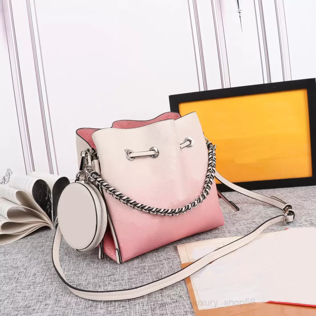 Crossbody Gradient colour Mahina leather bella bucket bag with removable coin purse women Hollow Out perforated pattern Drawstring Bags attached wallet
Crossbody Gradient colour Mahina leather bella bucket bag with removable coin purse women Hollow Out perforated pattern Drawstring Bags attached wallet
