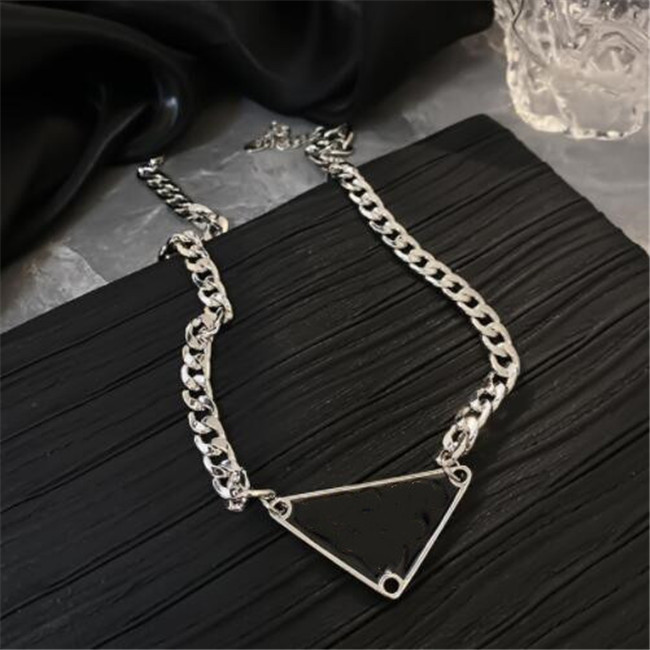 New style Street inverted triangle letter necklace men and women cold wind hip hop silver clavicle chain net red explosion necklace chokers jewelry
New style Street inverted triangle letter necklace men and women cold wind hip hop silver clavicle chain net red explosion necklace chokers jewelry