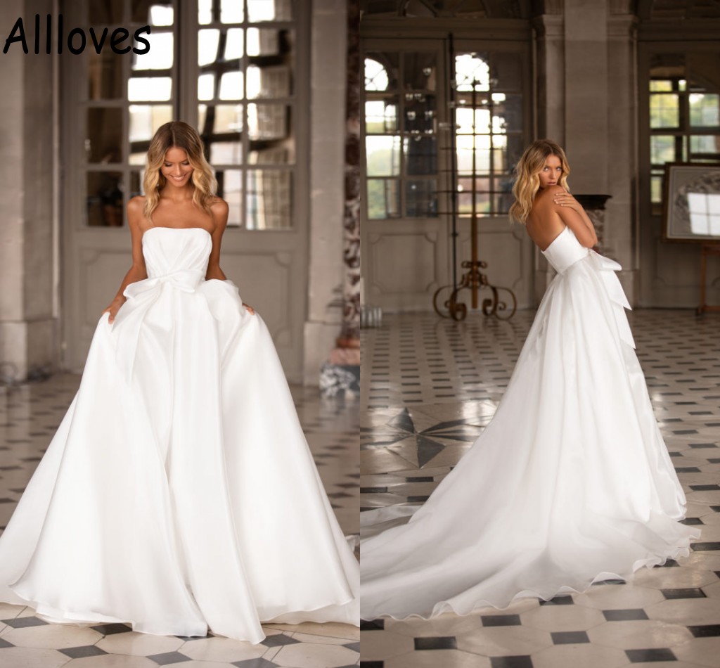 Strapless A Line Satin Wedding Gowns With Bow Simple Boho Garden Sleeveless Bridal Dresses Sexy Open Back Sweep Train Modest Robes de Mariee CL0647, Gold
Strapless A Line Satin Wedding Gowns With Bow Simple Boho Garden Sleeveless Bridal Dresses Sexy Open Back Sweep Train Modest Robes de Mariee CL0647, Gold