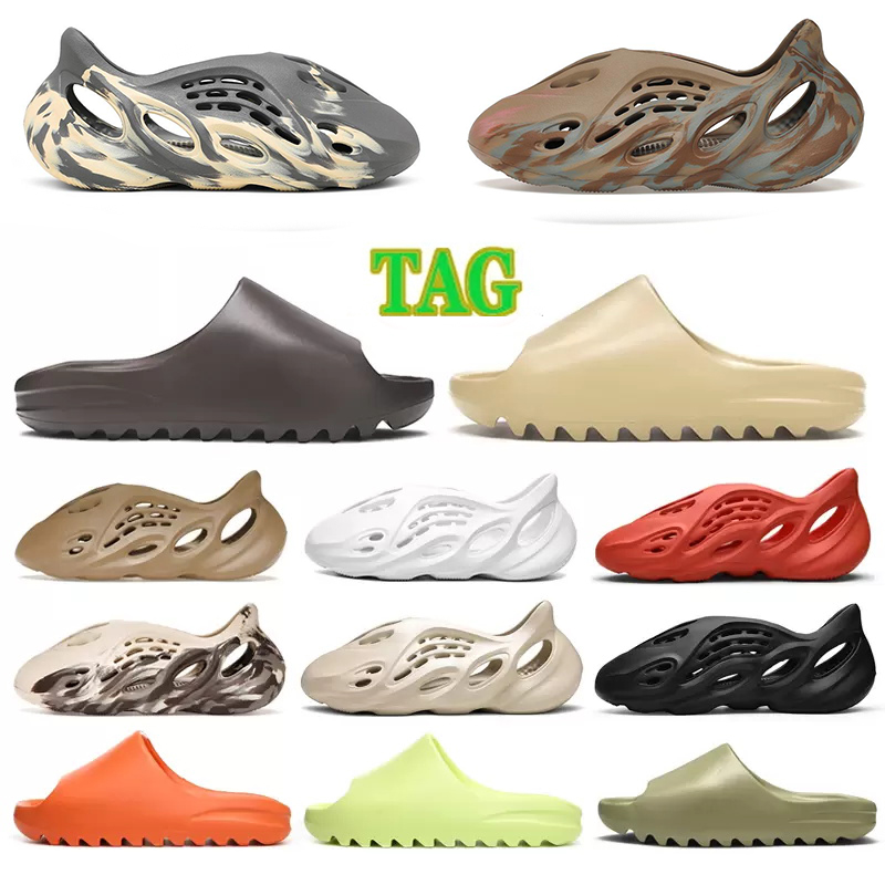Slippers Designer Foam runner Slides Sandals Men Women Designers Sneakers Shoe Desert Sand Bone Earth Triple White Black Fashion Scuffs Flip Flops Trainers 36-47
Slippers Designer Foam runner Slides Sandals Men Women Designers Sneakers Shoe Desert Sand Bone Earth Triple White Black Fashion Scuffs Flip Flops Trainers 36-47