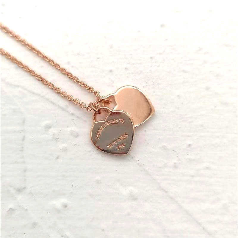 Luxury designer sterling silver necklace two-heart pendant women's fashion jewelry quality 210621
Luxury designer sterling silver necklace two-heart pendant women's fashion jewelry quality 210621