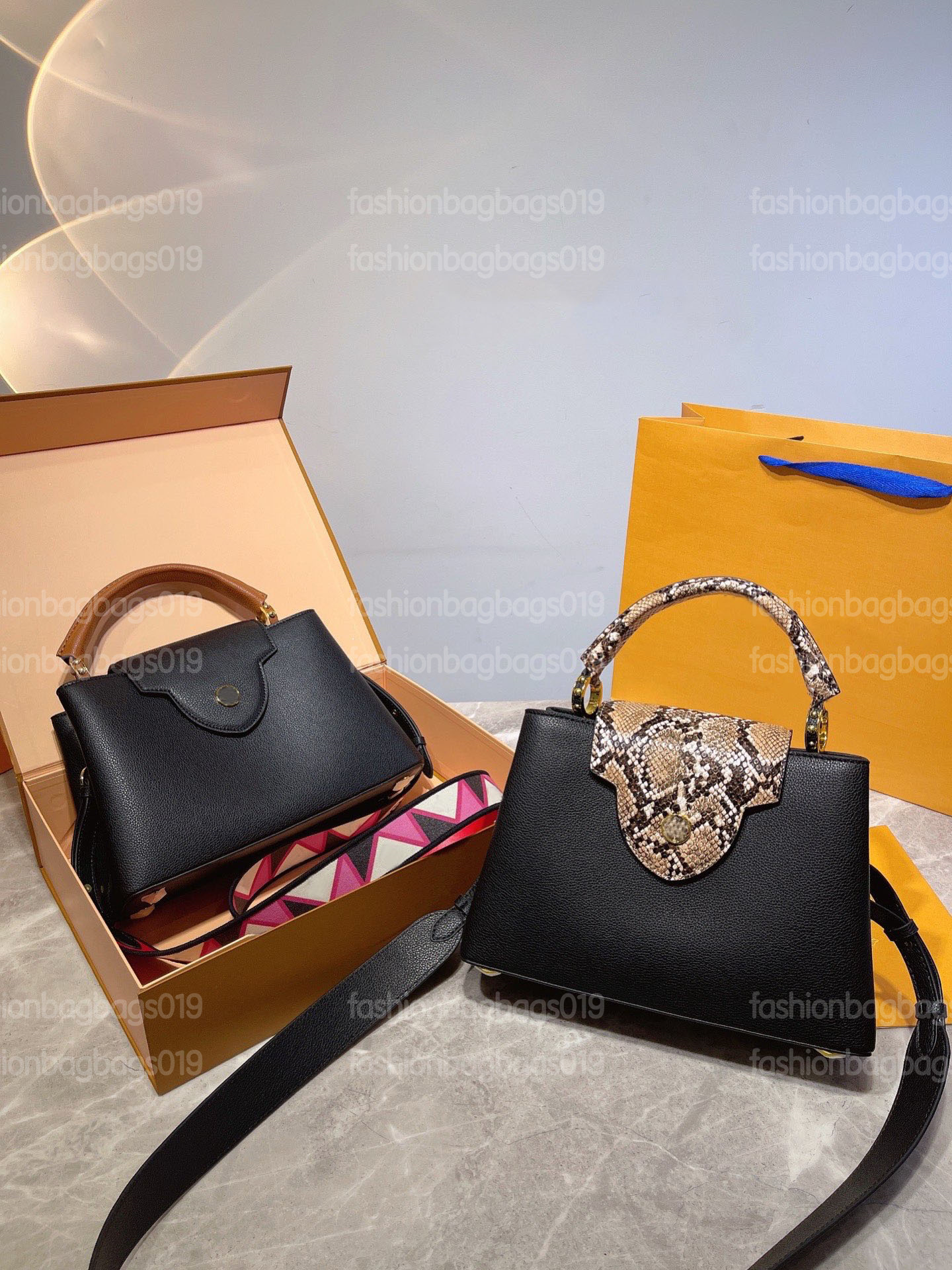 Capucines BB Serpentine Handle Bag Taurillon leather Luxurys Shoulder Bag Casual Bussiness Cross Body with Colorful Strap 
Capucines BB Serpentine Handle Bag Taurillon leather Luxurys Shoulder Bag Casual Bussiness Cross Body with Colorful Strap